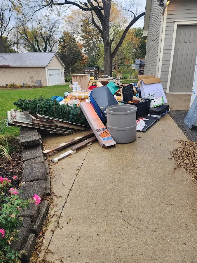 Dumpster being loaded with debris for 3 Yard Dumpster Rental in North Highlands